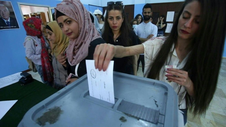 IMAGES Syrians cast their ballots at a polling stations in Damascus as voting began across Syria for an election where few doubt that President Bashar al-Assad will extend his grip on power for a fourth term.