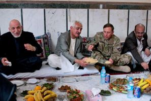 U.S. Army Gen. David H. Petraeus and Afghan President Hamid Karzai share lunch during a visit to Zaranj