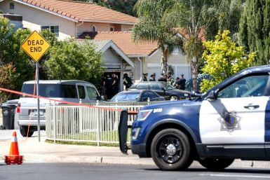 Emergency responders tend to a fire at the house of the suspected San Jose, California shooter on May 26, 2021