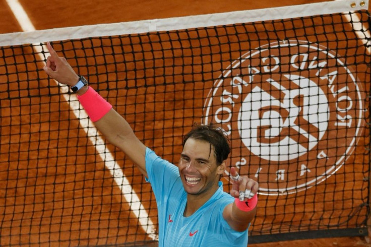 Champion: Rafael Nadal celebrates beating Novak Djokovic in last year's men's final