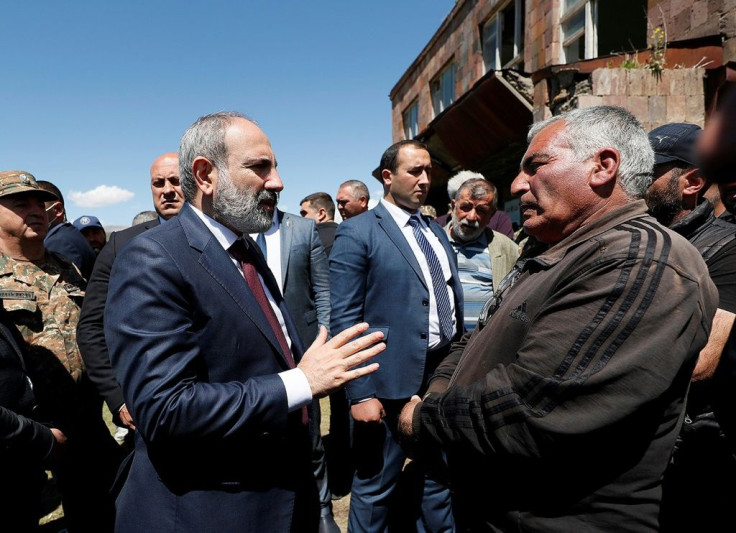 The capture of six soldiers comes at a delicate time for Armenian Prime Minister Nikol Pashinyan (L) ahead of snap elections next month