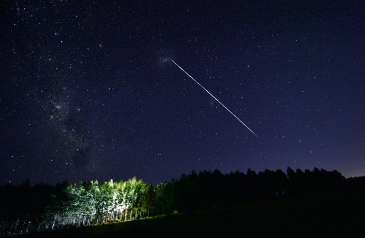 A long-exposure image shows a trail of a group of SpaceX's Starlink satellites passing over Uruguay -- but will the company's battery of satellites end up letting it "monopolise" space?