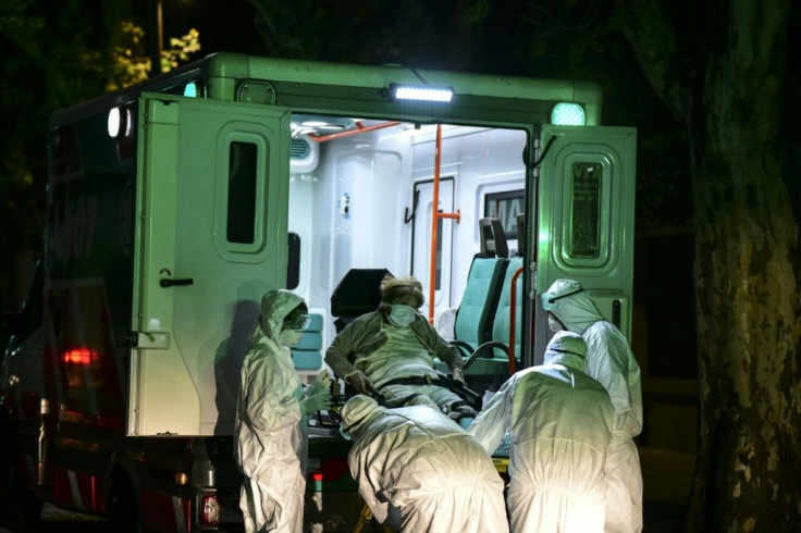 An elderly patient believed to be infected with Covid-19 is taken from a nursing home in Buenos Aires, Argentina in April 2021