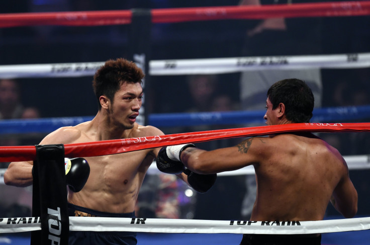 Ryoto Murata (L) of Japan and Gaston Vega of Argentina