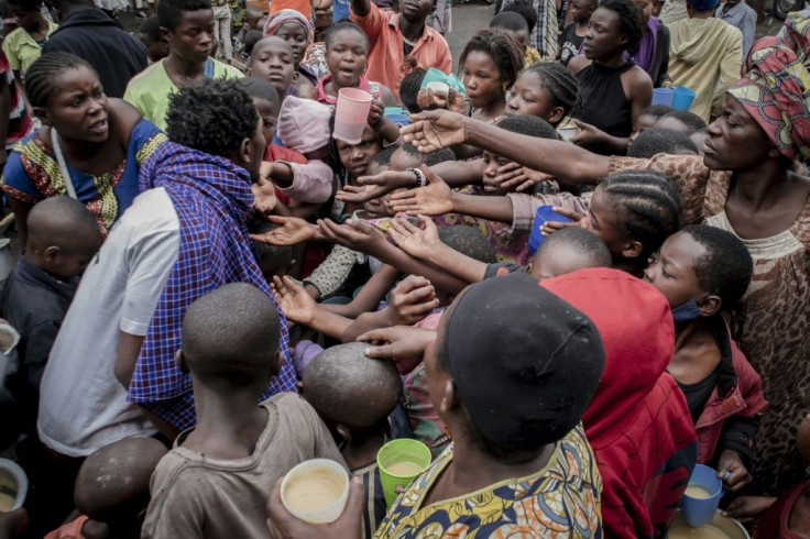 Aid: Displaced residents of Goma queue for food in the town of Sake