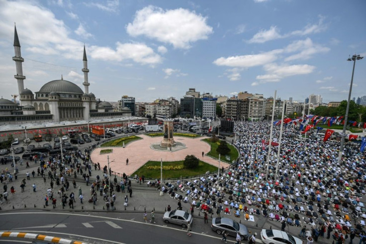 Thousands pray outside the new mosque in Taksim Square after the inside quickly filled