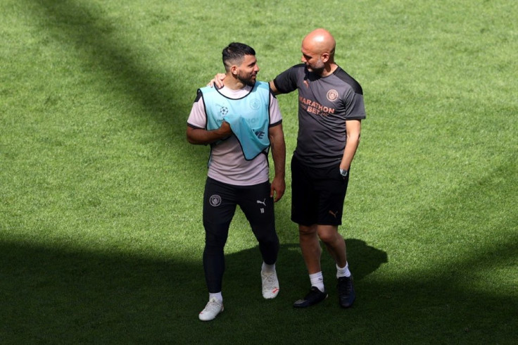 Manchester City's Sergio Aguero with coach Pep Guardiola at a training session on Friday