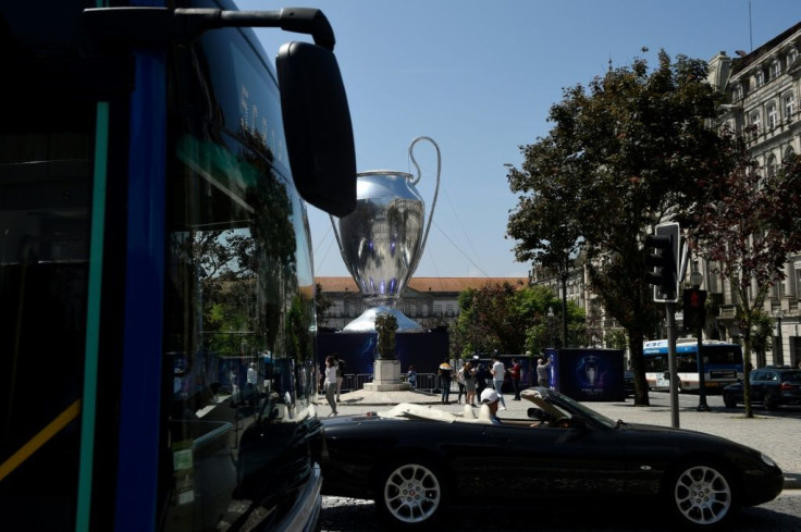 A giant inflatable replica of the Champions League trophy dominates Porto's central Avenida dos Aliados