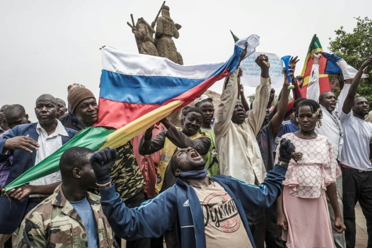 Several hundred people rallied to support the army in a central Bamako square, with Russian flags and portraits of Goita