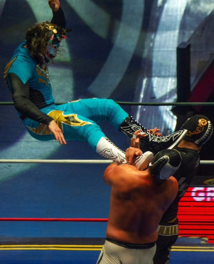 Wrestlers fight during an event in Mexico City's Arena Mexico on May 28, 2021 as an improved Covid situation has allowed the return of pro wrestling