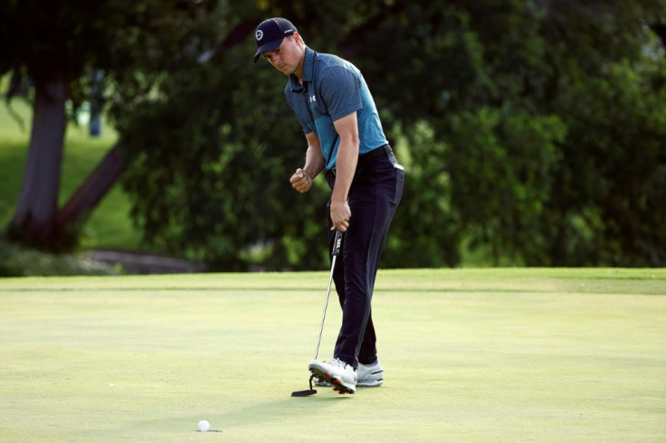 American Jordan Spieth reacts after a birdie putt at 18 to take a one-shot lead through three rounds of the US PGA Tour Charles Schwab Challenge
