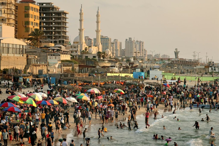 Palestinians gather at the beach in Gaza City on May 28, a week after a ceasefire brought an end to 11 days of hostilities between Israel and Hamas