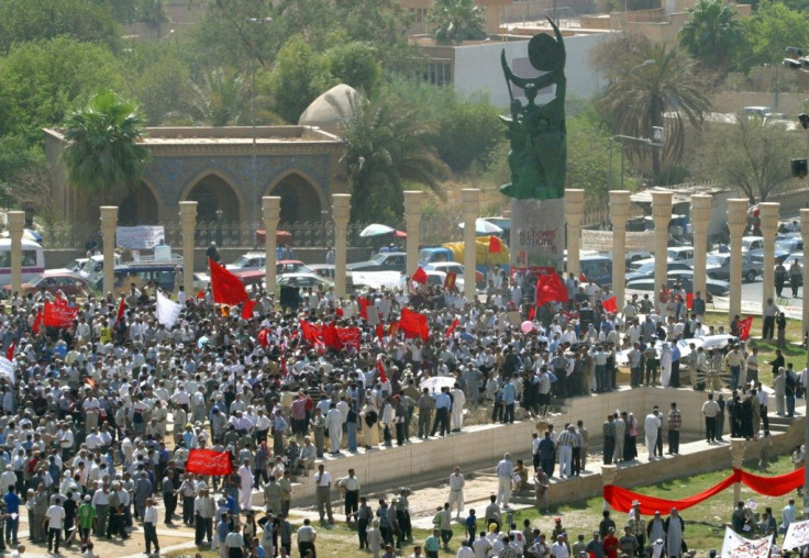 In this file photo, Iraqi communists commemorate the 1958 overthrow of the British-installed monarchy, the first in a succession of political upheavals that have seen Bell's role in the country's creation written out of school history books