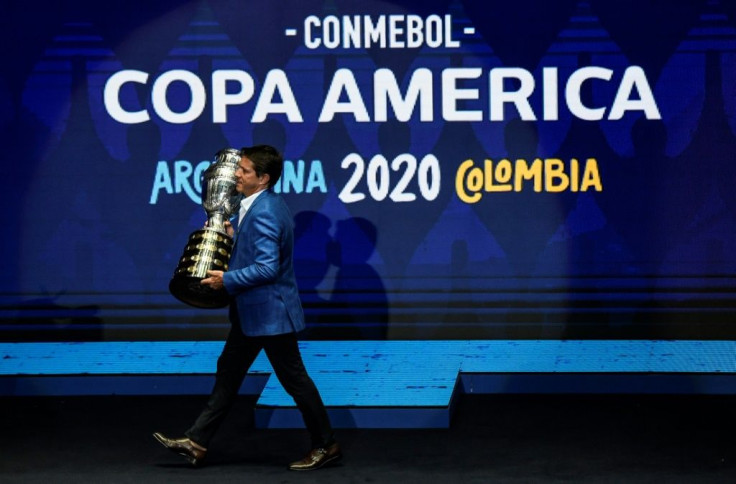 Former Brazil footballer Juninho Paulista presented the Copa America trophy at the draw ceremony in December 2019
