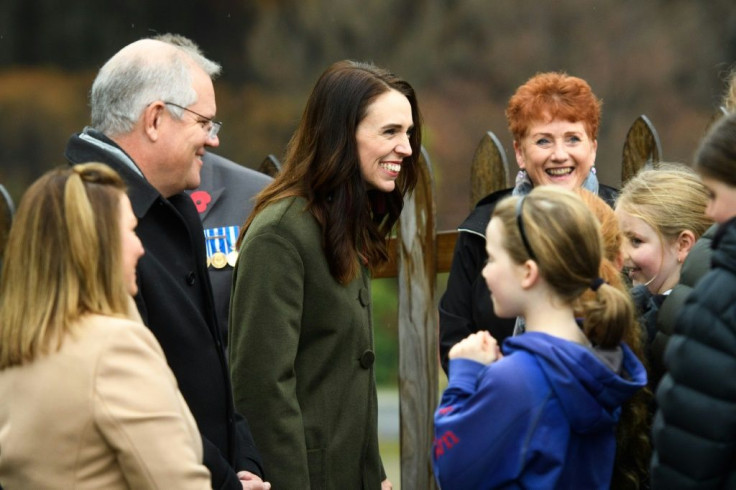 New Zealand Prime Minsiter Jacinda Ardern (C) and her Australian counterpart Scott Morrison (L) have played down their policy differences on China