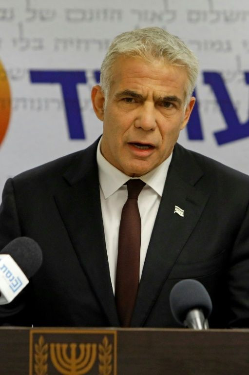 Opposition leader and Chairman of Israel's Yesh Atid party Yair Lapid speaks during a weekly party meeting at the Knesset in Jerusalem on May 24