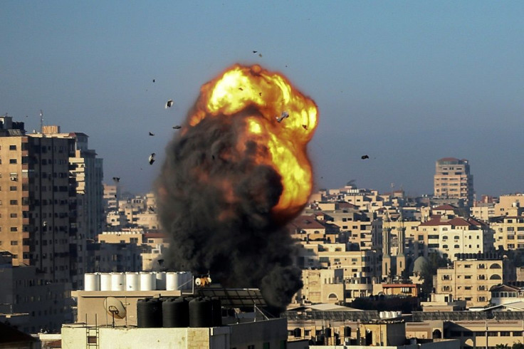 A fireball and smoke billow during an Israeli airstrike on Gaza City on May 15