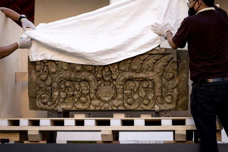 The two ancient sandstone lintels, a sacred late 10th or 11th century sandstone support beam, were returned to Thailand after decades in the United States