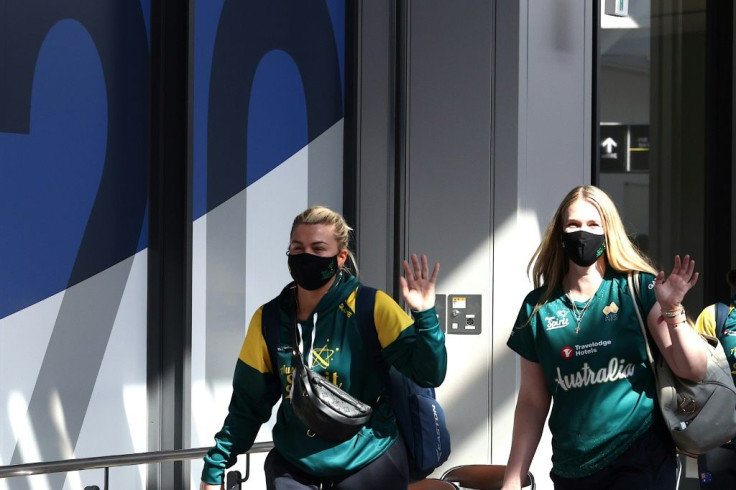 Australia's softball team is the first to arrive for the virus-postponed Olympics