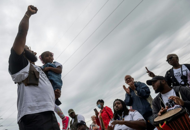 A man gestures after a soil dedication ceremony for victims of the 1921 Tulsa Massacre, on the 100-year anniversary in Tulsa, Oklahoma