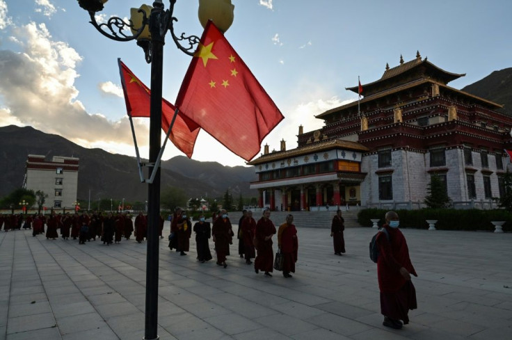 Chinese flags and the aphorisms of President Xi Jinping pepper the college grounds