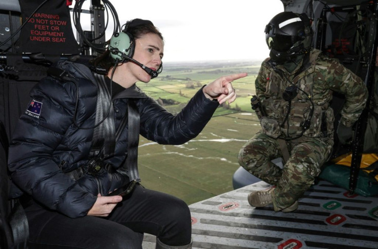 New Zealand's Prime Minister Jacinda Ardern inspects the flood damage from an army helicopter
