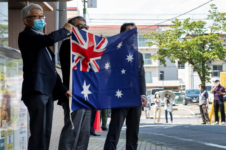 Hotel staff greeted the team with an Australian flag on arrival in Ota