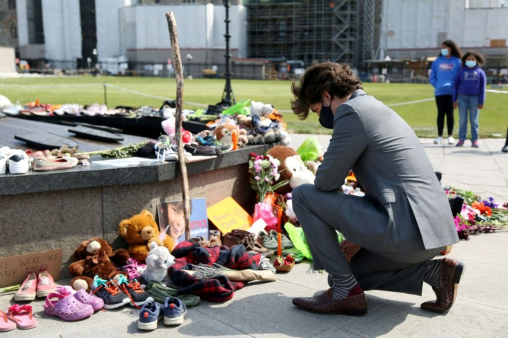 Canadian Prime Minister Justin Trudeau visits a makeshift memorial erected in Ottawa in honor of the 215 indigenous children whose remains found at a boarding school in British Columbia