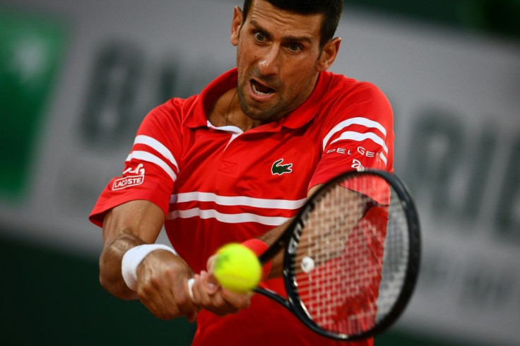Eyes have it: Novak Djokovic returns the ball to Tennys Sandgren