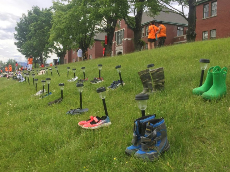 Tributes of shoes have been left at the Kamloops Indian Residential School in Kamloops, British Columbia, in memory of the 215 children whose unmarked graves were last week found on the residential school site