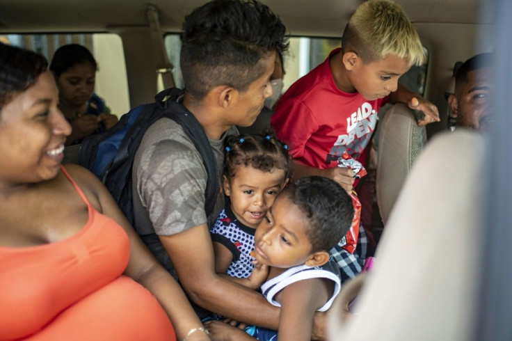 A group of migrants at the shelter in Matamoros board a van to go get tested for Covid-19