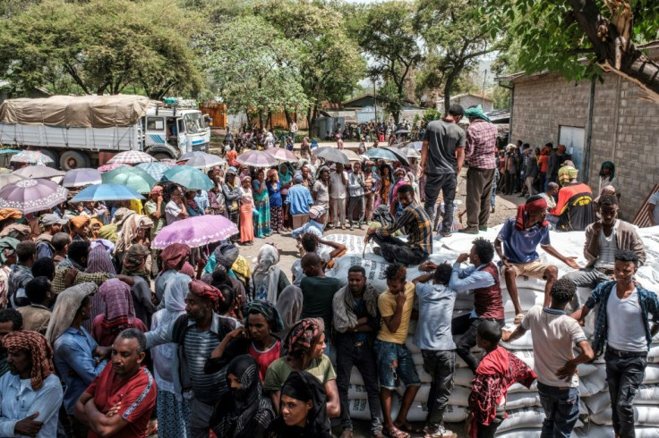 Most residents have fled the town, with crowds gathering only when officials hand out sacks of wheat as food aid.Â 