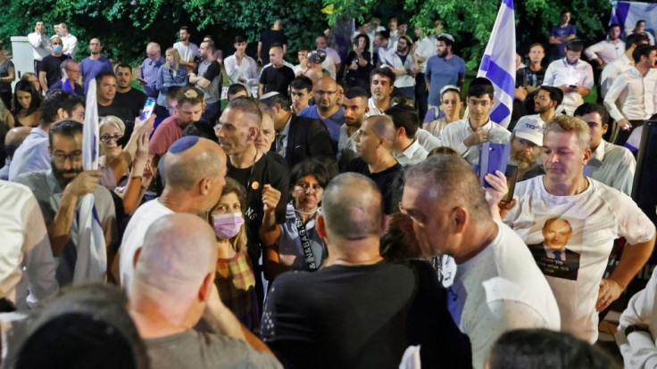 Fans of Israeli Prime Minister Benjamin Netanyahu gather in Tel Aviv for a defiant rally in his support