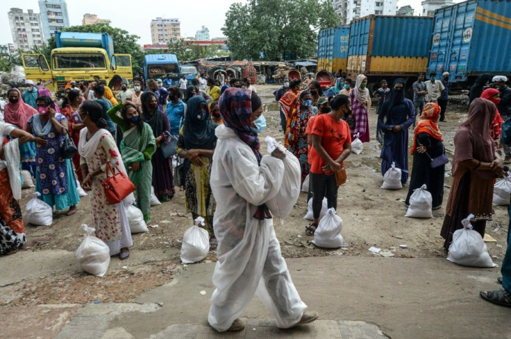 Transgender people wait to collect relief supplies during a coronavirus lockdown in Dhaka last year