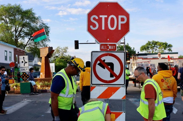 City workers prepare on June 3, 2020 to reopen the intersection in Minneapolis, Minnesota where George Floyd was murdered