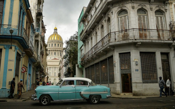 An old American car passes near the Capitol in Havana, on May 3, 2021