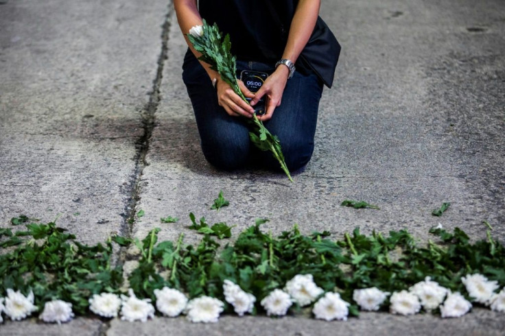 An artist in Hong Kong mourns the victims of China's deadly Tiananmen Square crackdown after authorities banned an annual vigil and vowed to stamp out any protests on the June 4 anniversary