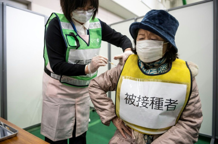 Japan has secured enough AstraZeneca doses for 60 million people but is not administering it, as concerns linger about rare blood clots