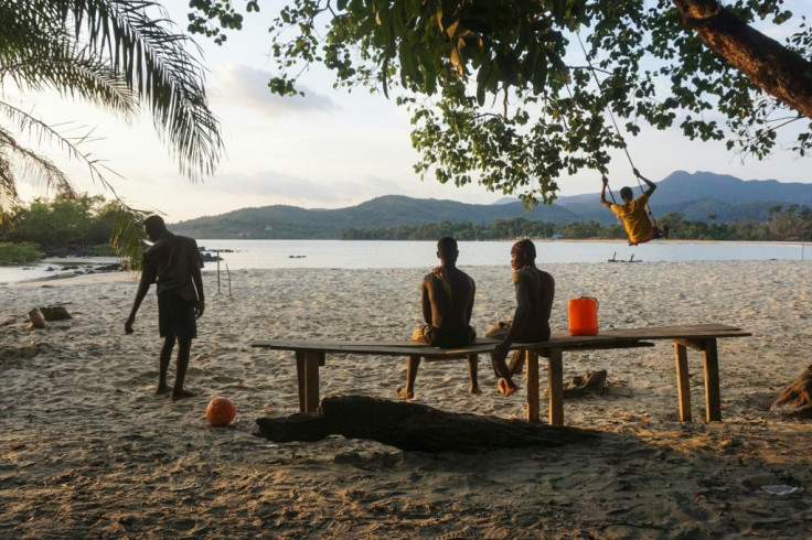 Teenagers on the Black Johnson beach. A tourist attraction 22 miles south of the capital Freetown, Black Johnson village is nestled between stunning black-and-gold beaches and virgin rainforest