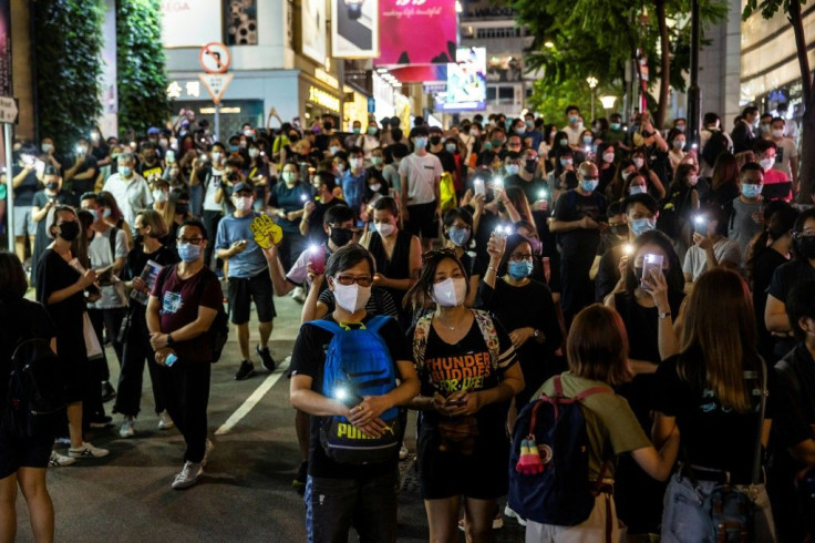 Unable to muster in the traditional park, some shone mobile phone torches in nearby streets