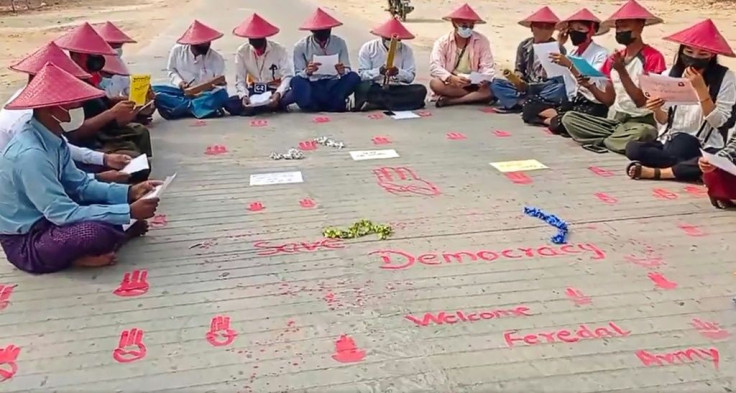 Demonstrators take part in a poetry reading as part of protests against Myanmar's military coup