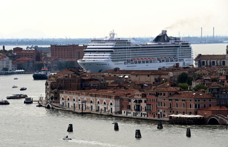 The MSC Orchestra cruise ship sails across the basin as it leaves Venice