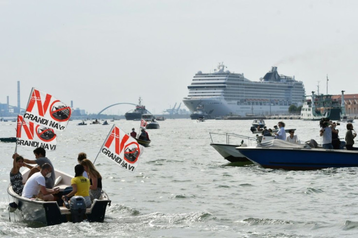 Environmental protesters from the "No Grandi Navi" group demonstrate aboard small boats