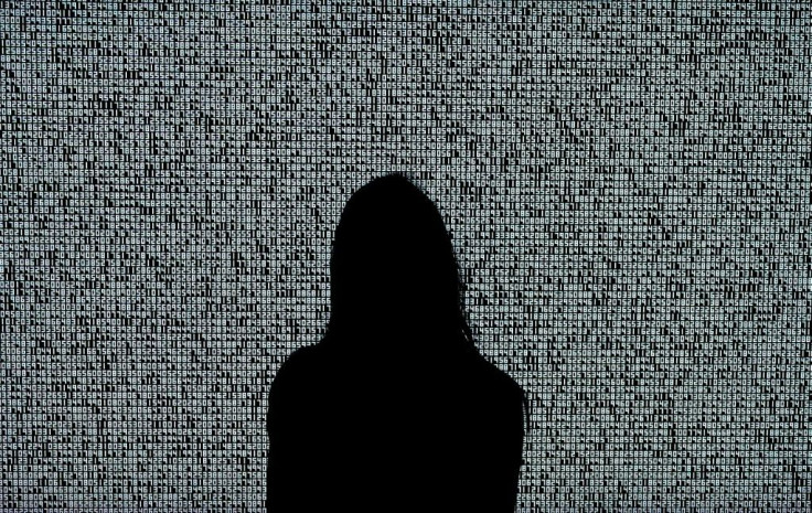 A woman looks at an NFT by Ryoji Ikeda titled 'A Single Number That Has 10,000,086 Digits' during a media preview at Sotheby's in New York ahead of an NFT auction June 10, 2021