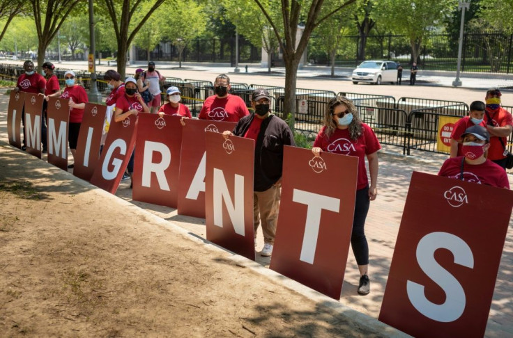 Immigration rights activists take part in a rally to demand action on citizenship at Lafayette Square, across from the White House in Washington, DC on May 26, 2021