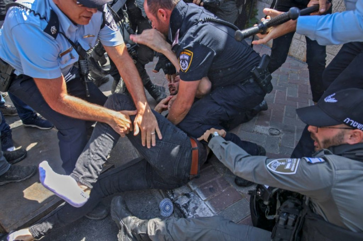 Israeli security forces detain a Palestinian protestor during a protest over Israel's planned evictions of Palestinian families