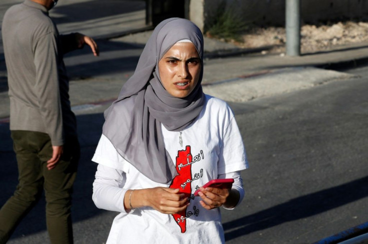 Palestinian activist Mona el-Kurd takes part in a rally to demand the reopening of the Israeli police checkpoint at the entrance of the Sheikh Jarrah neighbourhood on May 29; her father said she was arrested on June 6