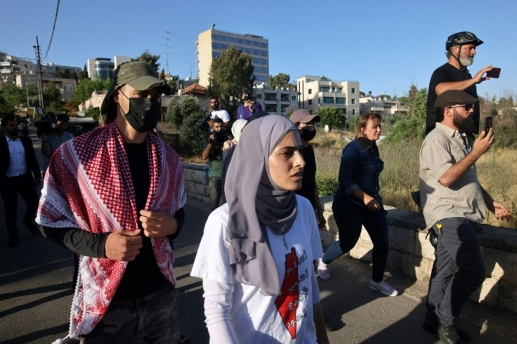 Palestinian activist Mona el-Kurd takes part in a rally to demand the reopening of the Israeli Police checkpoint at the entrance of the Sheikh Jarrah neighbourhood in east Jerusalem on May 29
