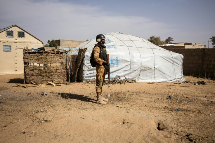 A Burkina Faso soldier patrols at a camp in Dori sheltering people displaced from northern Burkina Faso.