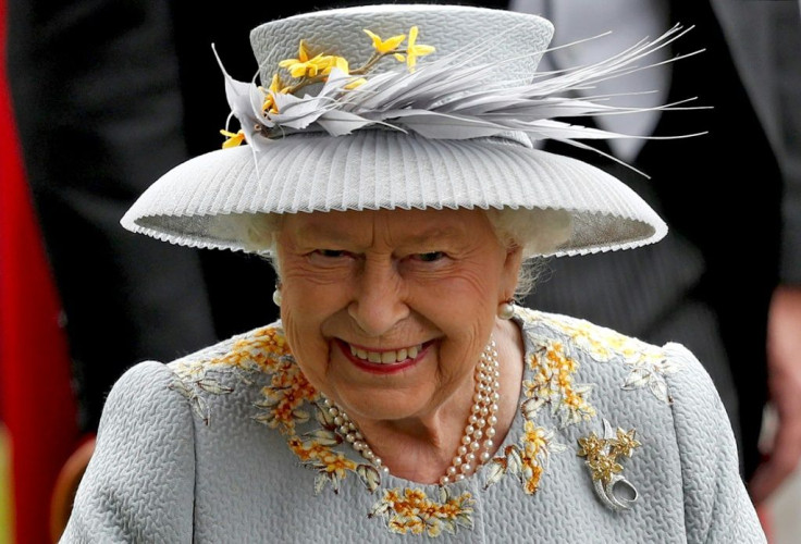 (FILES) In this file photo Britain's Queen Elizabeth II smiles as she attends day three of the Royal Ascot horse racing meet, in Ascot, west of London. Britain's Queen Elizabeth II and her family are "delighted" at the birth of a daughter to her grandson 